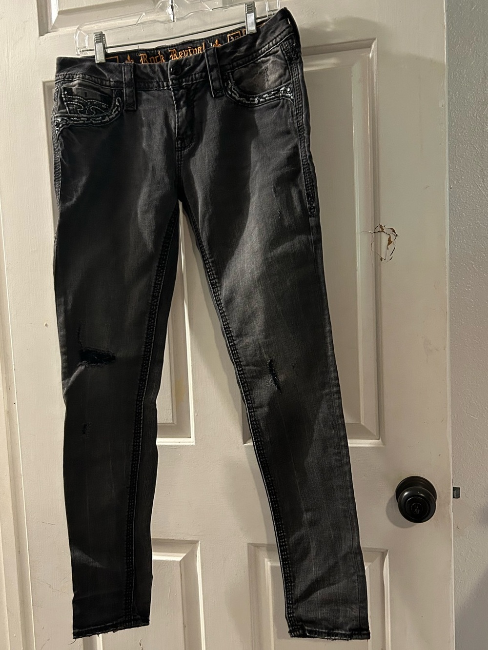 Rock Revival Women's Black Skinny Jeans with Subtle Distress